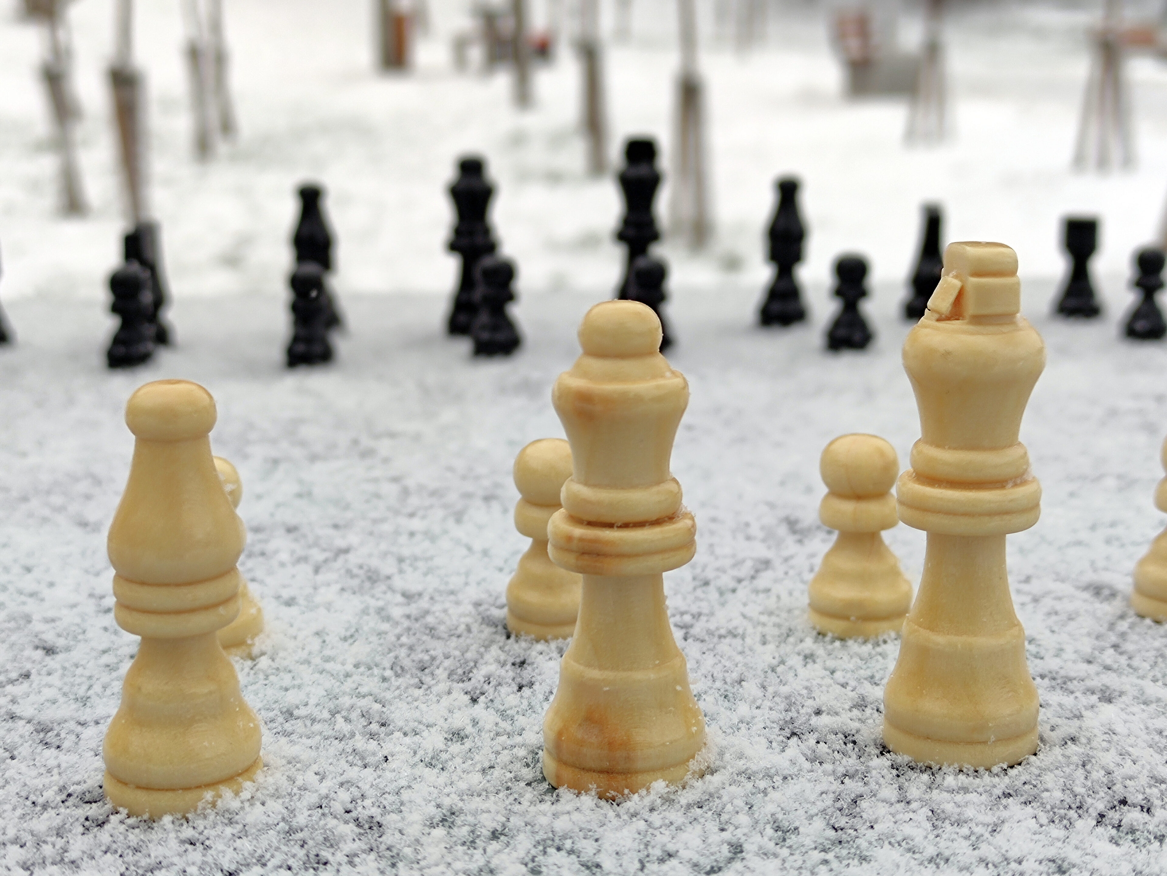 Snow covers a chessboard with chess pieces during the launch of the second stage of the project carried out by the Embassy of the State of Israel in Ukraine - IMD Business School - IMD Business School