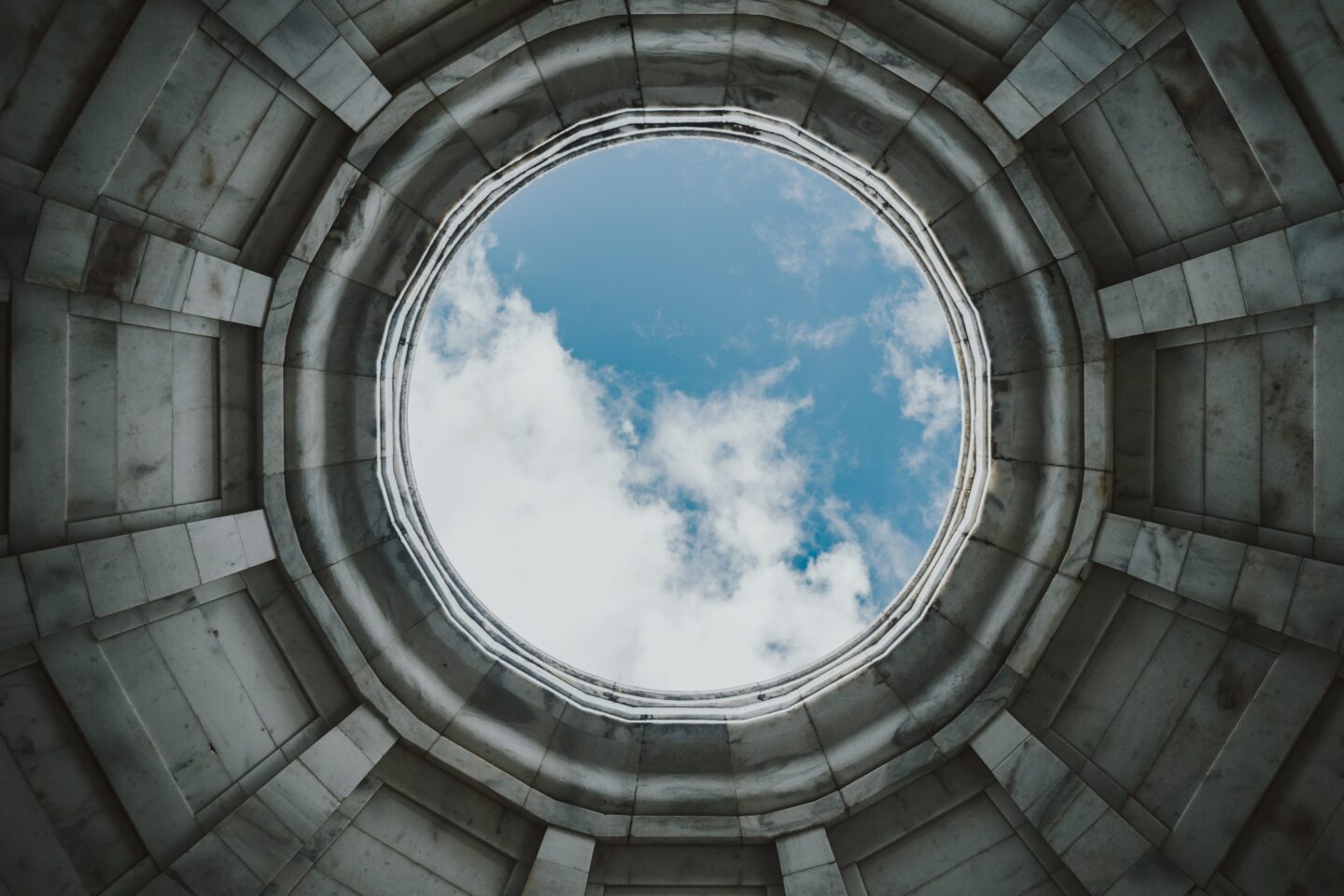 A round hole showing blue sky