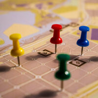 supply chain reorganization - pawns moving on a map