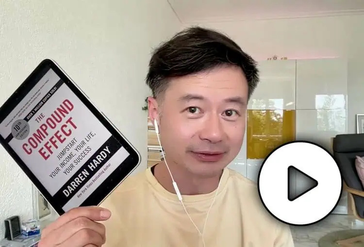 - IMD Business School Howard Yu holding a tablet with the cover book of "The Compound Effect" on the screen - IMD Business School